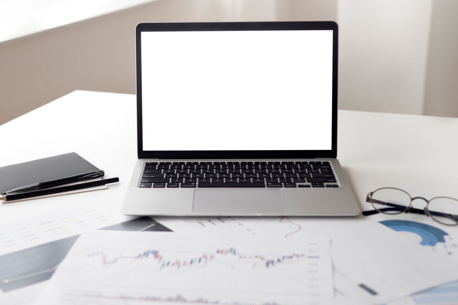 Laptop and business documents on a desk