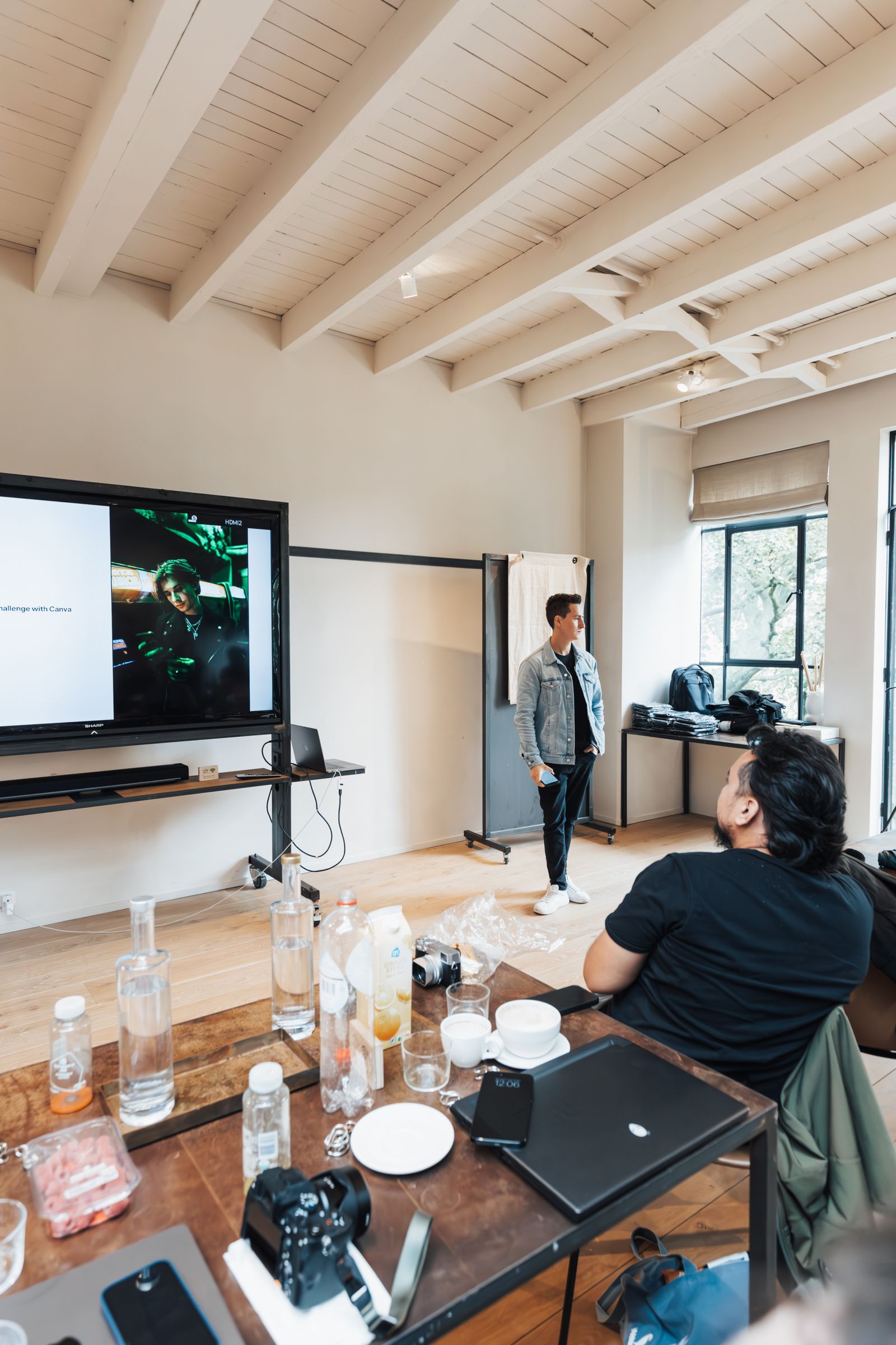 Speaker beside a presentation screen