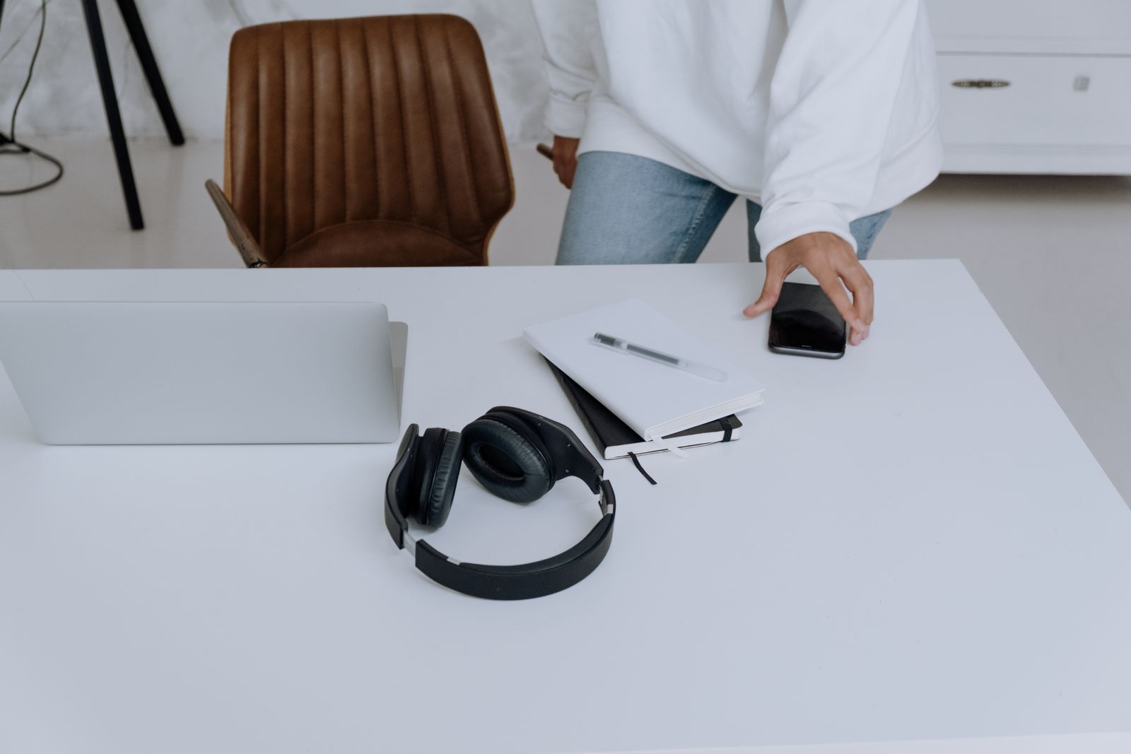 Headphones and laptop at a workspace