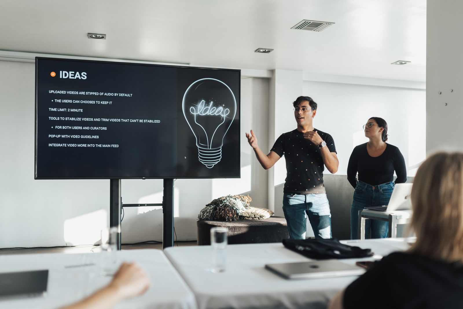 Presenter explaining an idea to colleagues