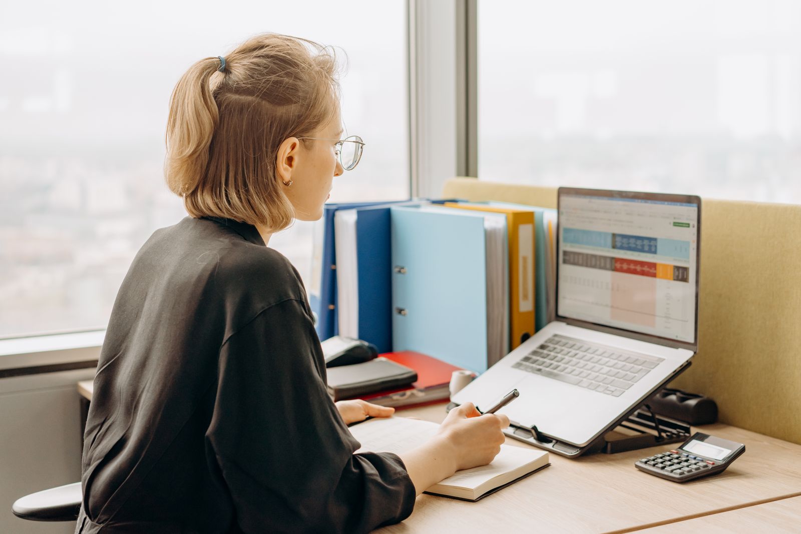 Professional reviewing information on a laptop