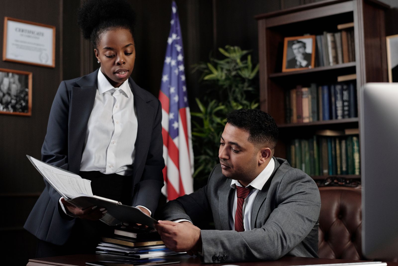 Legal professionals conducting a restricted review of confidential documents