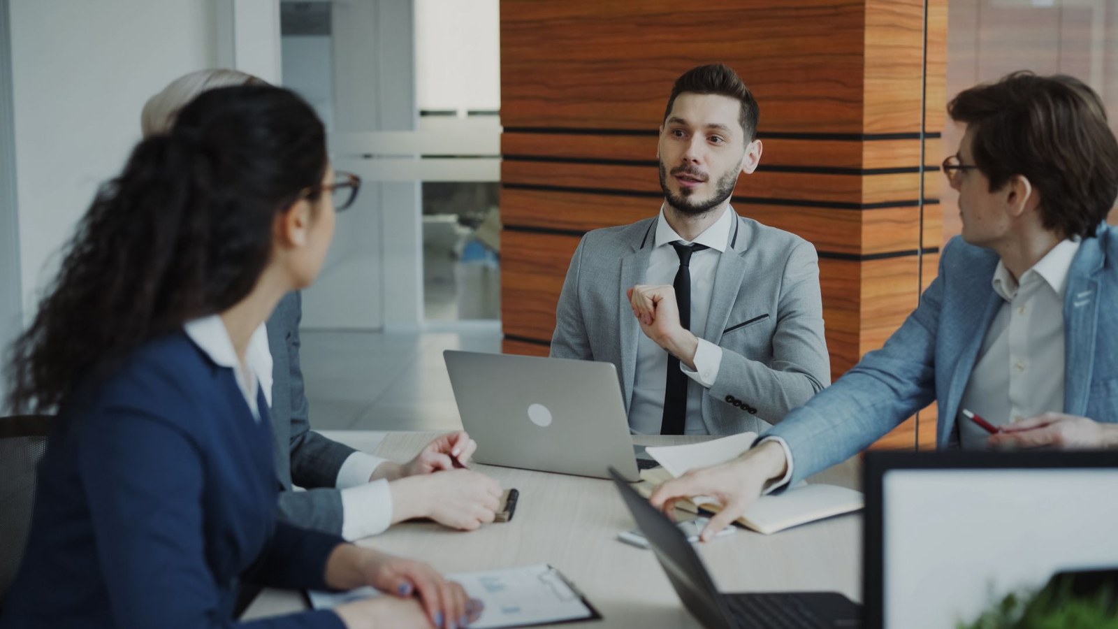 Private equity professionals discussing a transaction and portfolio plan